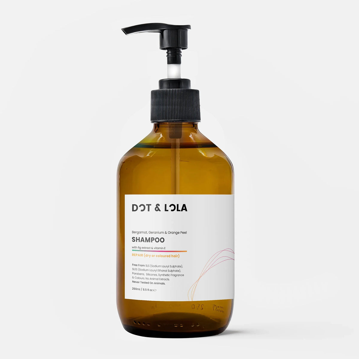 Amber bottle of Dot & Lola plant-based shampoo with pump, designed for dry or coloured hair repair